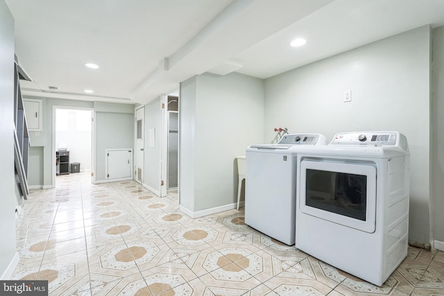 washroom with separate washer and dryer and light tile patterned floors