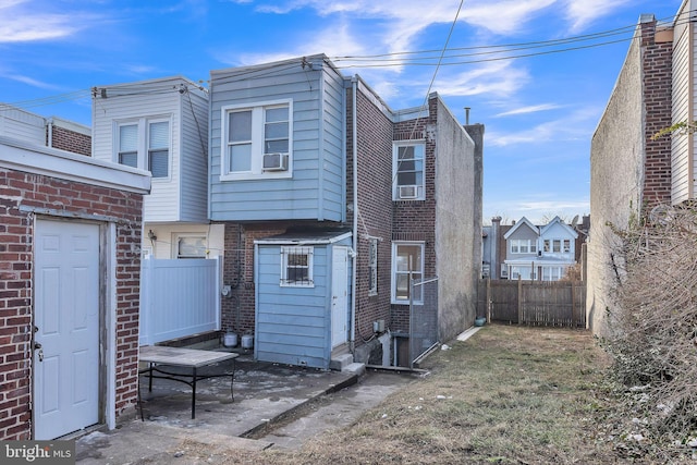 rear view of property featuring a patio