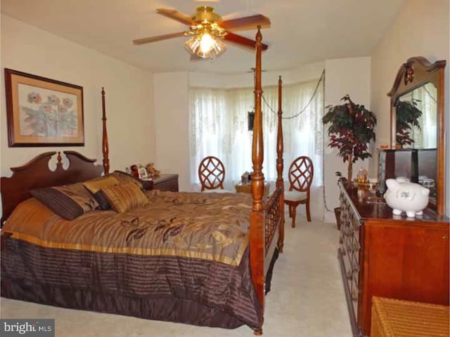 bedroom featuring light carpet and ceiling fan