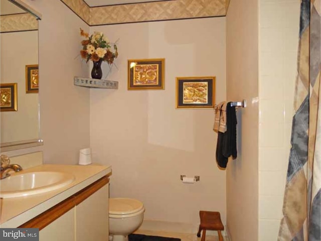 bathroom with vanity and toilet