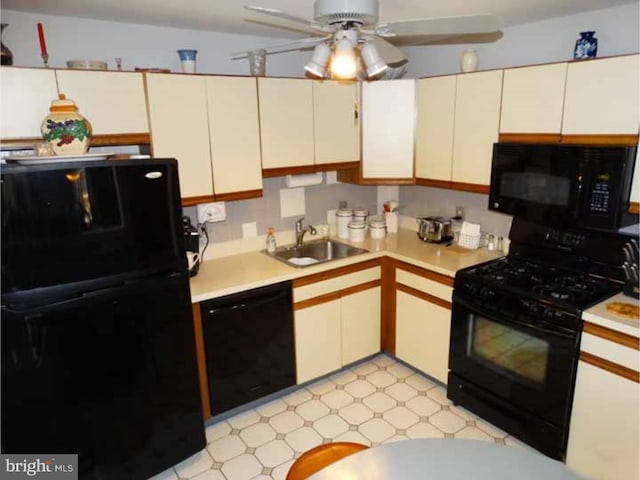 kitchen with white cabinetry, sink, black appliances, and ceiling fan