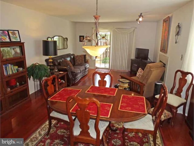 dining space with hardwood / wood-style flooring