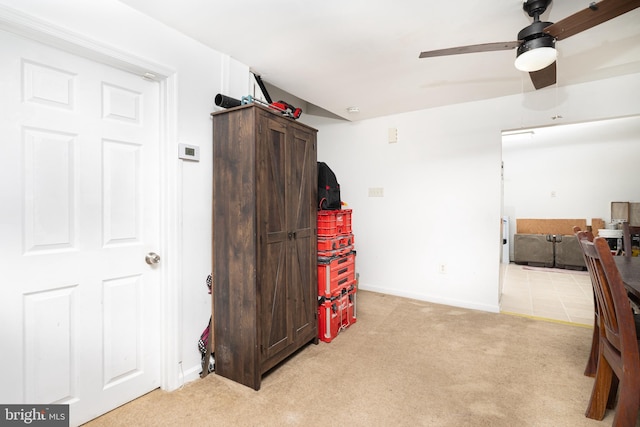 interior space with ceiling fan