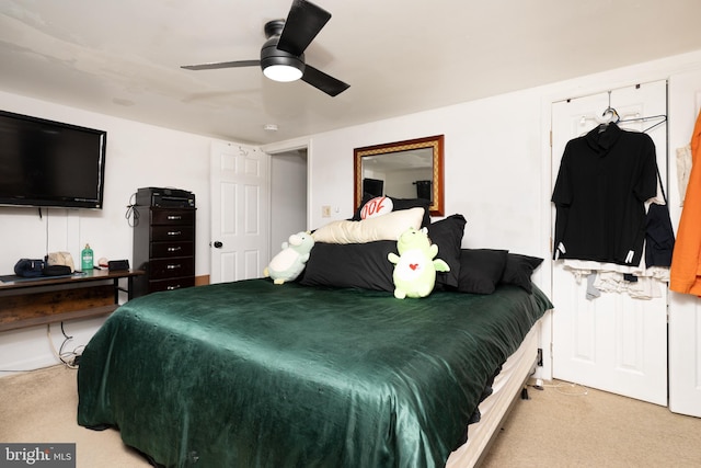 bedroom with light colored carpet and ceiling fan