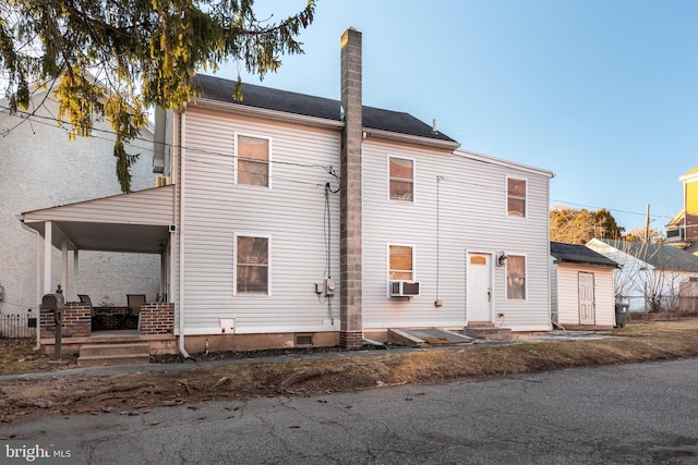 back of house with cooling unit