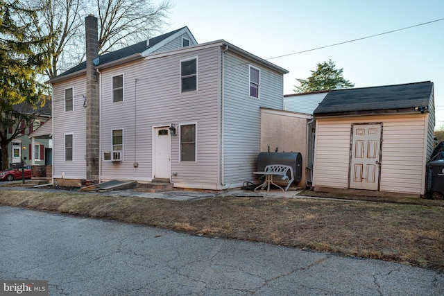 view of front of property with cooling unit