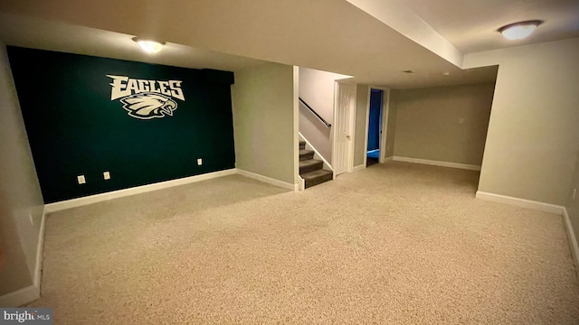 basement with light colored carpet