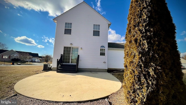 back of house with a patio and central AC