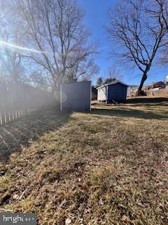 view of yard with a storage shed