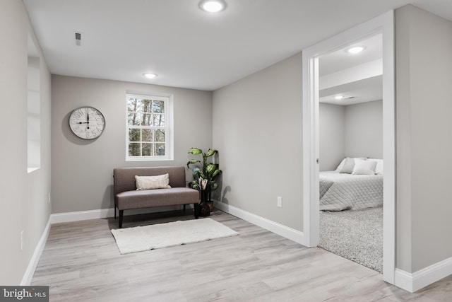 living area with light hardwood / wood-style floors