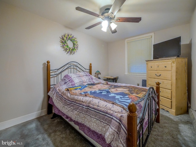 bedroom with dark colored carpet and ceiling fan