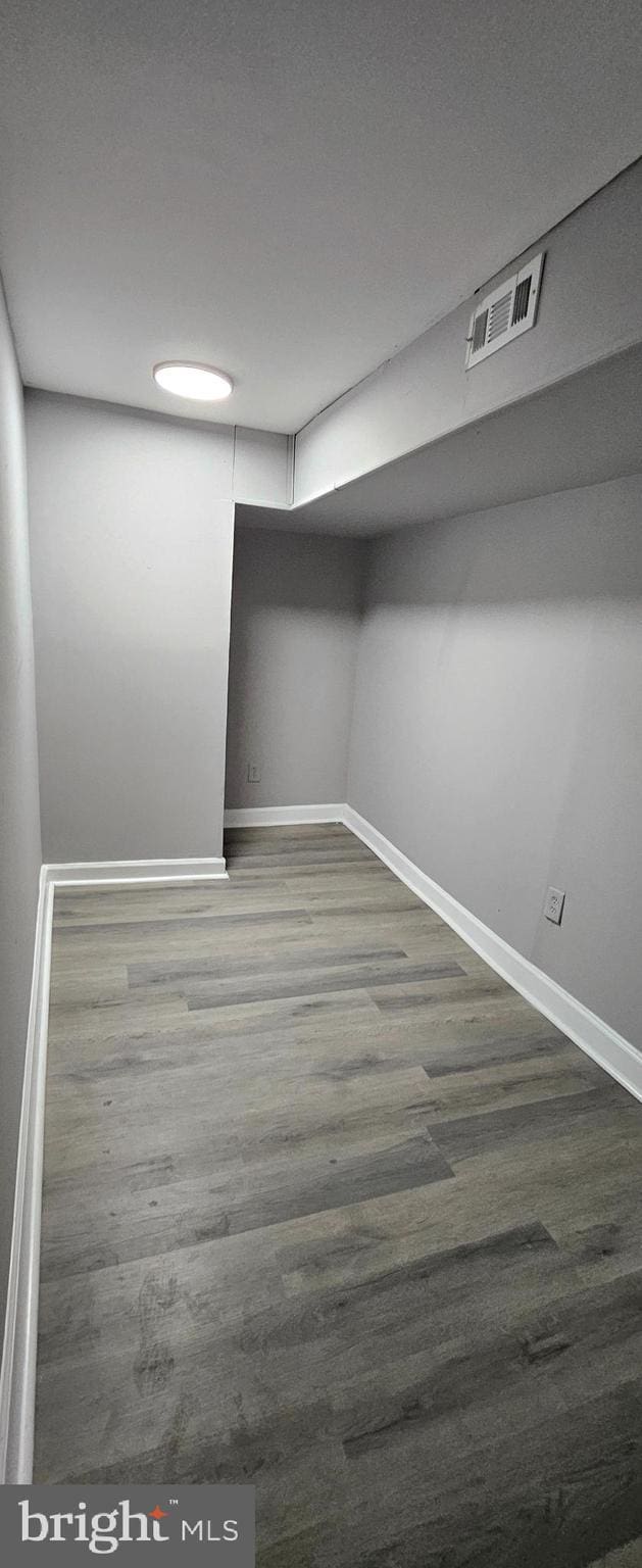 spare room with dark hardwood / wood-style flooring