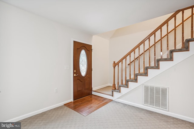 entrance foyer with carpet