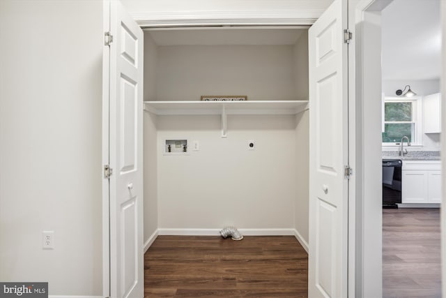 laundry area with dark wood-type flooring, sink, hookup for a washing machine, and electric dryer hookup