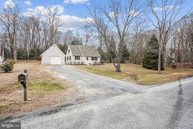 view of front of house featuring a garage and a front lawn