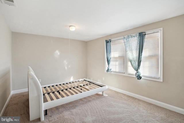 unfurnished bedroom with carpet flooring