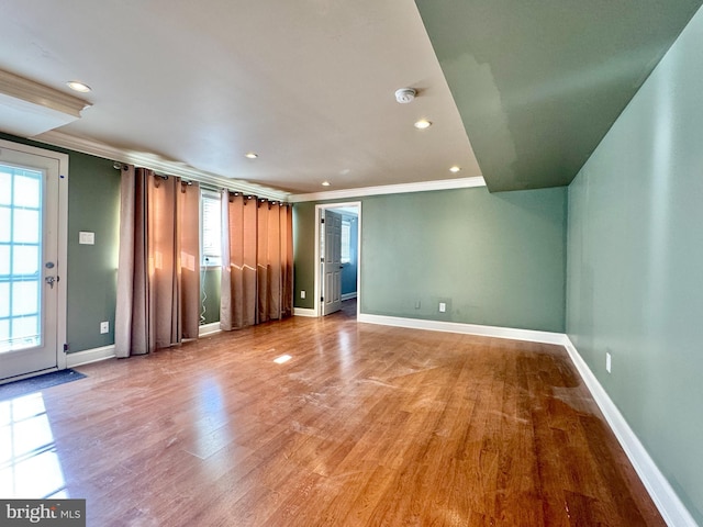 interior space featuring ornamental molding and light hardwood / wood-style floors