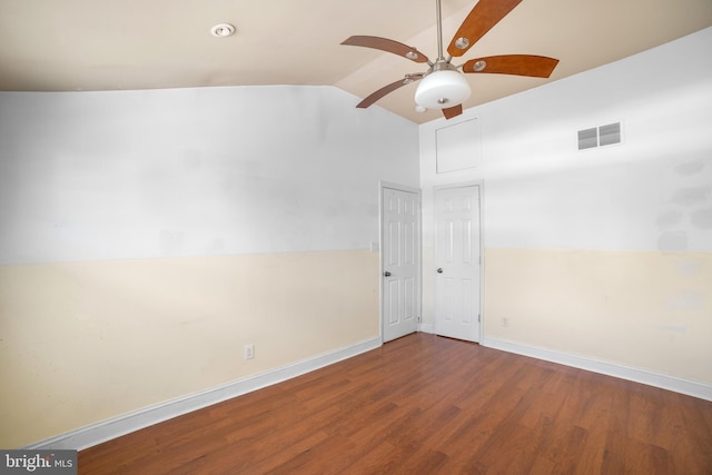 empty room with wood-type flooring, ceiling fan, and vaulted ceiling