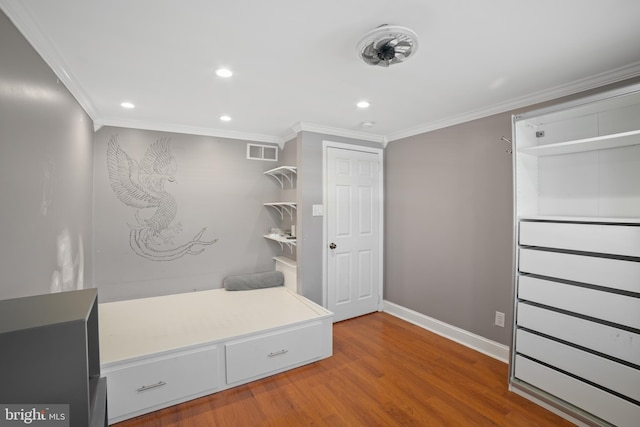 mudroom featuring crown molding and hardwood / wood-style floors