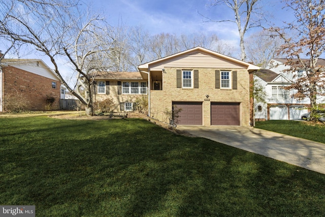 tri-level home with driveway, a front lawn, and an attached garage