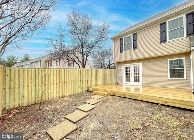 exterior space with a wooden deck and french doors