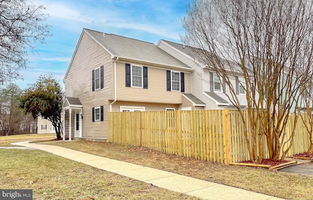 view of side of home with a lawn