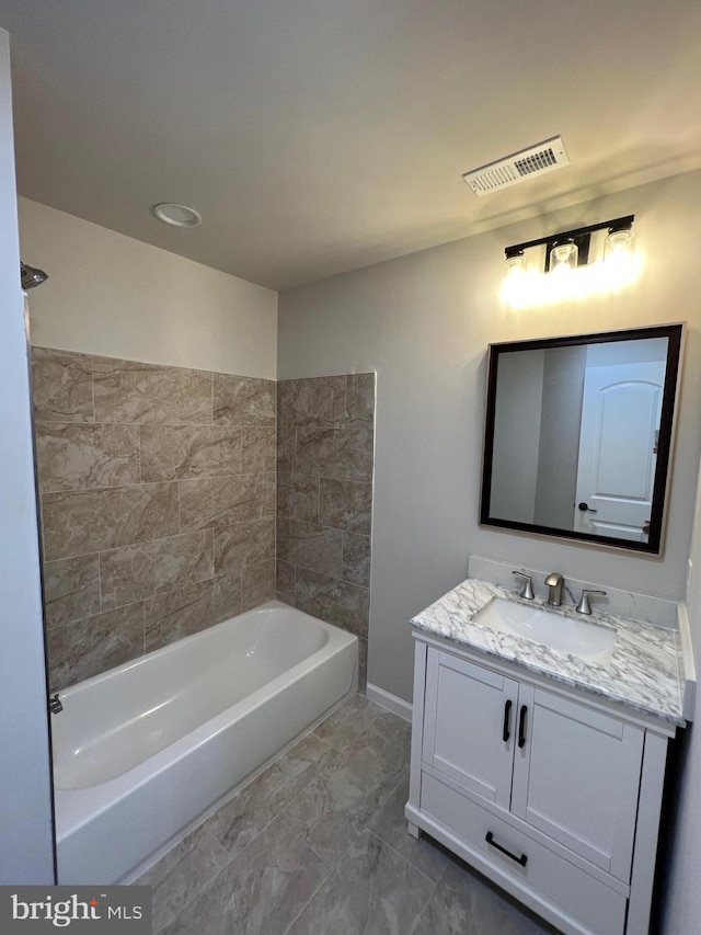 bathroom with vanity and bathtub / shower combination