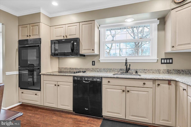 kitchen featuring sink, crown molding, light stone counters, dark hardwood / wood-style flooring, and black appliances