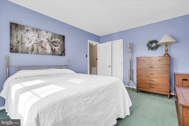 bedroom with dark carpet and a closet