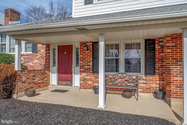 property entrance featuring covered porch