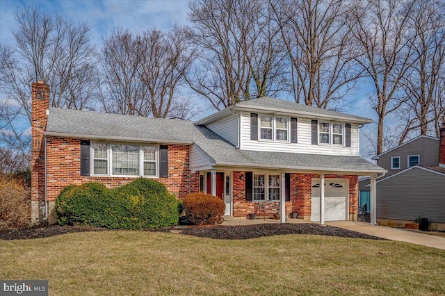 split level home with a garage and a front yard