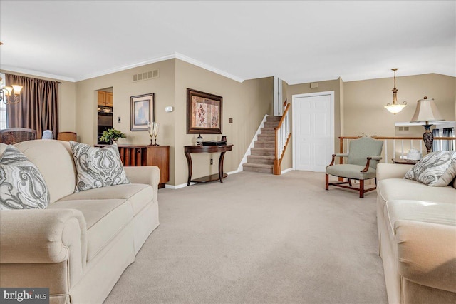 living room featuring light colored carpet, ornamental molding, and a chandelier