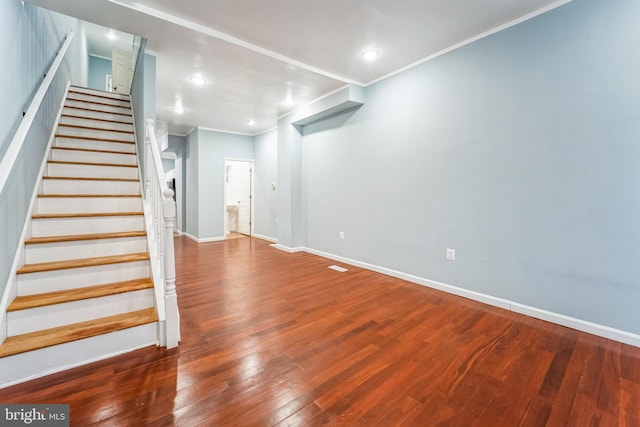 interior space featuring crown molding and wood-type flooring