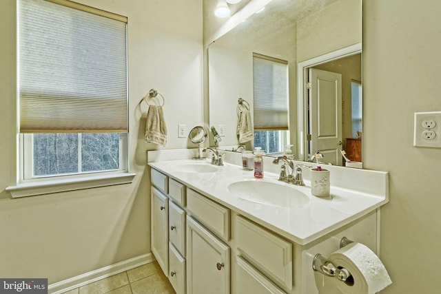 bathroom with vanity, tile patterned flooring, and a wealth of natural light