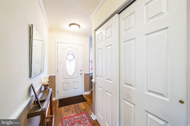 entryway with ornamental molding and dark wood-type flooring