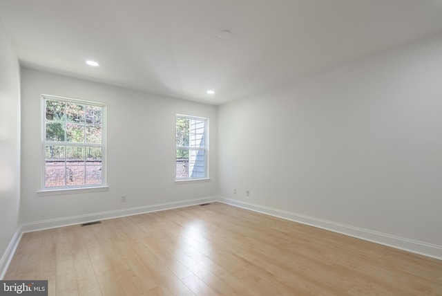 unfurnished room featuring light hardwood / wood-style floors