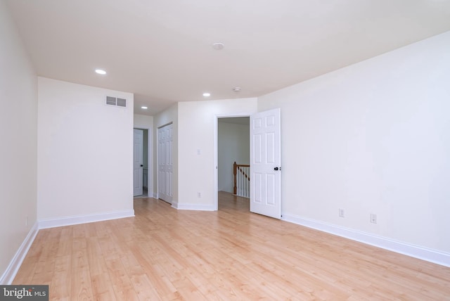 spare room featuring light hardwood / wood-style flooring