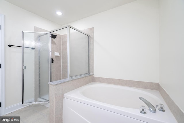 bathroom featuring tile patterned floors and shower with separate bathtub