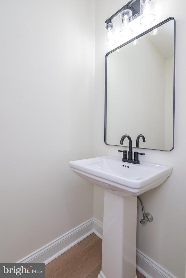 bathroom featuring sink and hardwood / wood-style floors