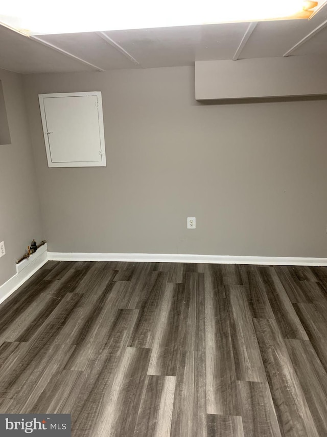 basement featuring dark hardwood / wood-style flooring