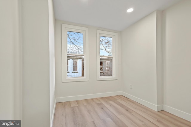 unfurnished room with light hardwood / wood-style floors