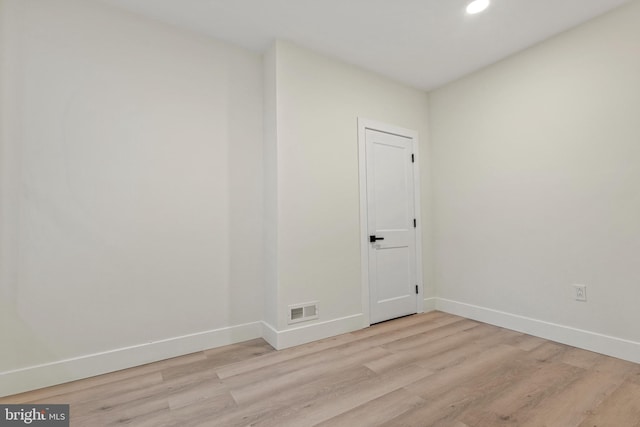 unfurnished room with light hardwood / wood-style floors