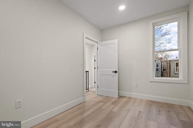 spare room with light wood-type flooring