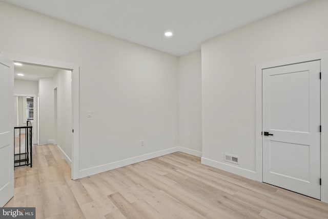 unfurnished room with light hardwood / wood-style flooring