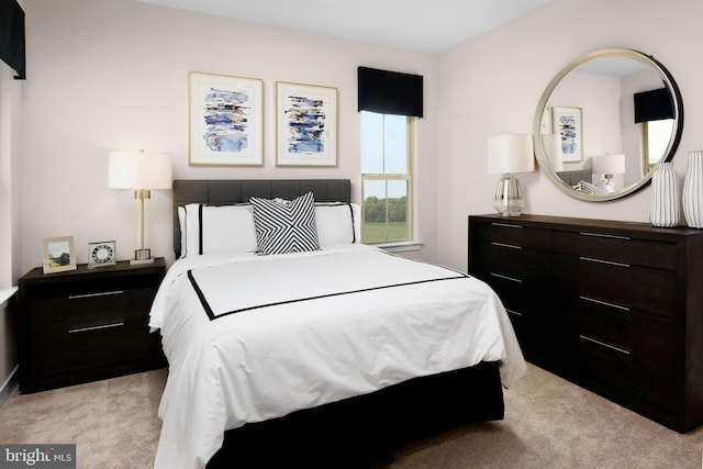 bedroom featuring light carpet