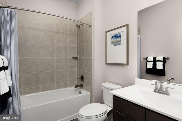 bathroom featuring shower / bath combo with shower curtain, toilet, and vanity