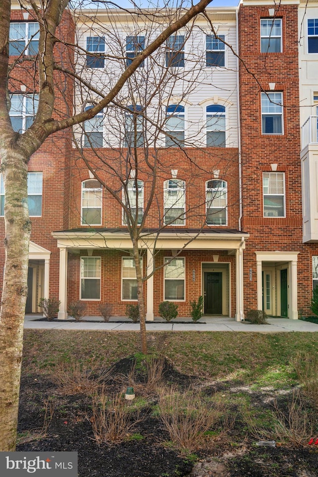 view of front of home with brick siding