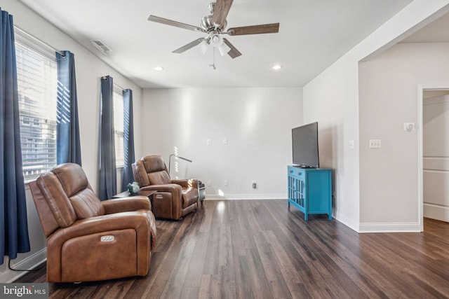 living area with recessed lighting, baseboards, a ceiling fan, and dark wood-style flooring