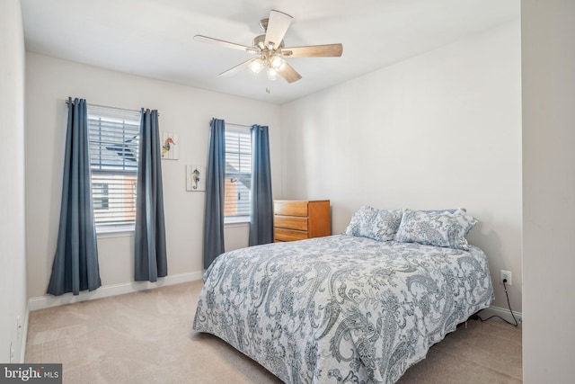 bedroom with carpet flooring, ceiling fan, and baseboards