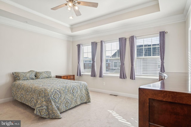 carpeted bedroom featuring visible vents, a raised ceiling, and baseboards